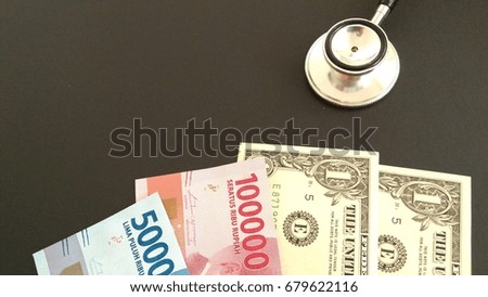 Insurance or Finance Conceptual. Stethoscope with money. blurry, out of focus 