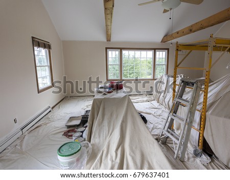 Room in a family house being painted Royalty-Free Stock Photo #679637401