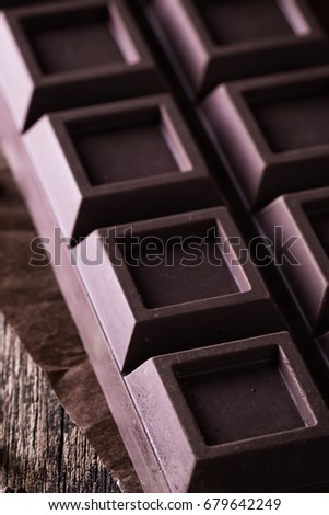 Dark chocolate stack, on wooden table,chocolate concept background