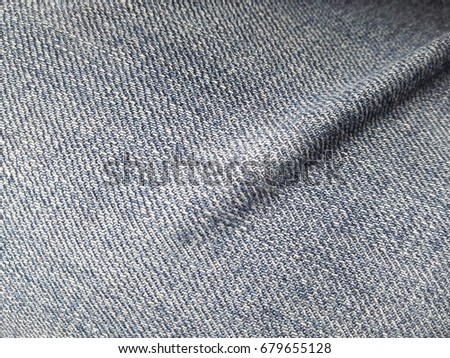 Texture of Jeans cloth, strong rigid textile making high durability pants for working, travel or fashion in western style