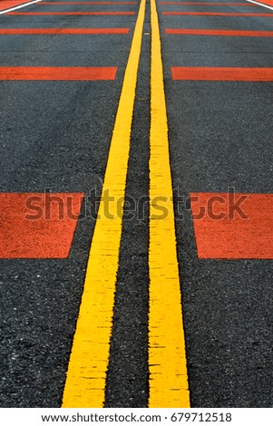 Yellow and red traffic line on the road.