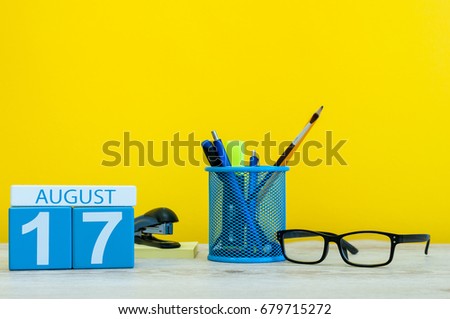 August 17th. Image of august 17, calendar on yellow background with office supplies. Summer time