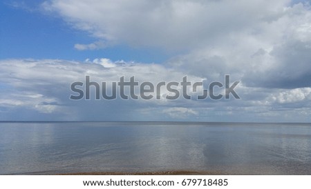 Serene seascape, clouds blue sky. Latvia. Baltic sea.