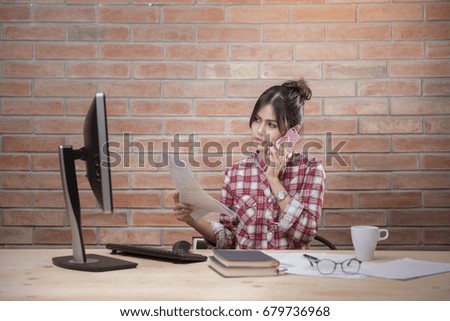 Beautiful woman is working in home office 