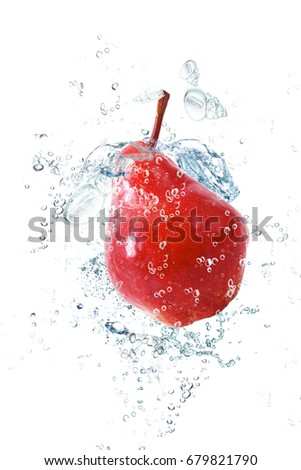 fresh pear falling in water