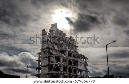Demolition
A part demolished office building is highlighted against a dramatic sky. Royalty-Free Stock Photo #679856779
