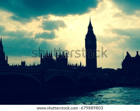 Big ben parliament houses stock photo in westminster London, UK. across thames in silhouette stormy duotone - stock image