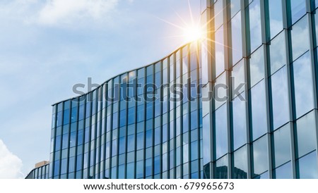 Modern business skyscrapers, high-rise buildings, architecture raising to the sky, sun. Concepts of financial, economics, future etc. Royalty-Free Stock Photo #679965673