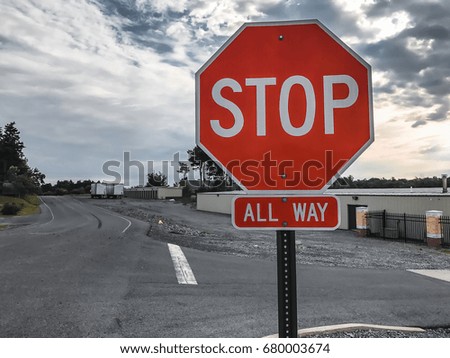 Stop sign with cloud sky