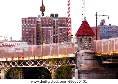 Train bridge in New York, with red tower in the foreground