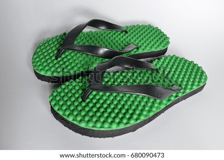 Green rubber slippers isolated on white background. 
