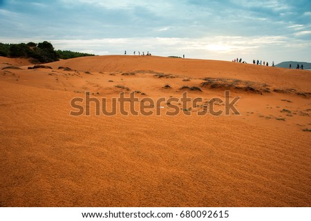 Popular desert area known for red-hued sand dunes & activities such as sand sledding in Phan Thiet, Vietnam.