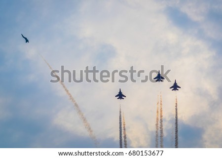 4 Sukhoi jet-fighter planes make the 'missing man formation' over India Gate in a flypast in New Delhi, India. Royalty-Free Stock Photo #680153677