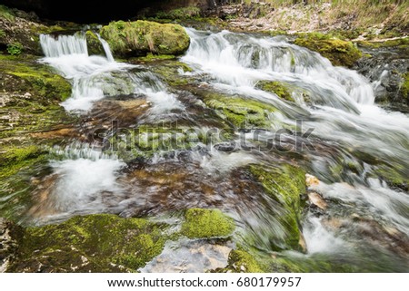 Waterfalls and water games between the rocks. Fontanon of Goriuda. Friuli