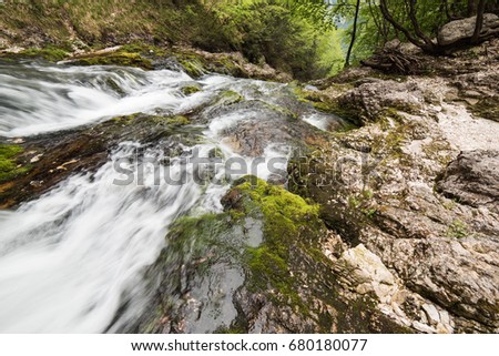 Waterfalls and water games between the rocks. Fontanon of Goriuda. Friuli