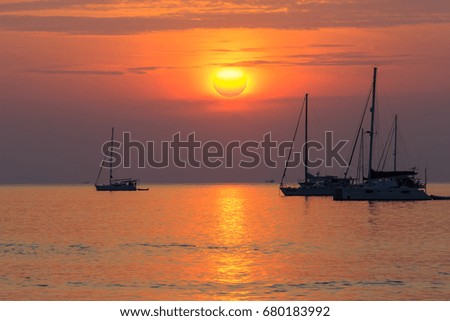 Beautiful sunset With boats At Nai Han Beach Phuket Thailand