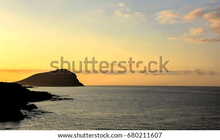 Sunrise on the Atlantic Ocean with a Mountain in Background El Medano Tenerife Canary Islands Spain