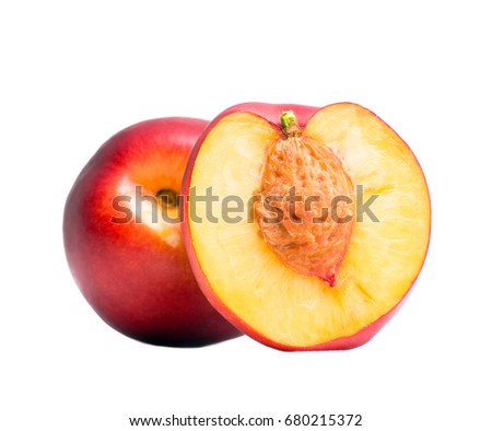 Nectarine whole and half of nectarine with a stone. Isolated nectarines on a white background. Summer juicy fruit. Healthy food. Bright juicy colors. Royalty-Free Stock Photo #680215372