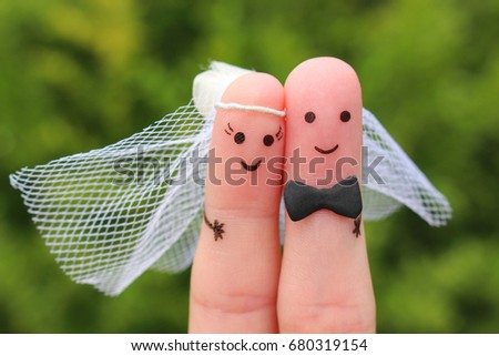 Fingers art of happy couple to get married. Concept of wedding ceremony. Royalty-Free Stock Photo #680319154