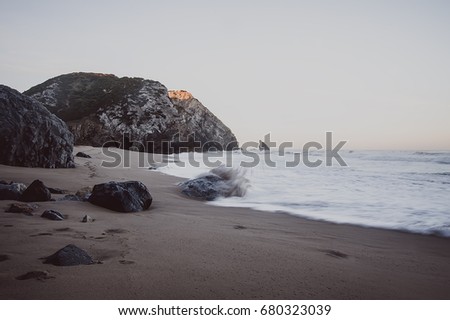 Atlantic ocean beach with rocks. vintage toned picture