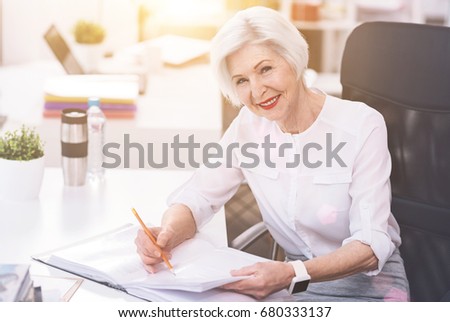 Respected competent lady checking some numbers