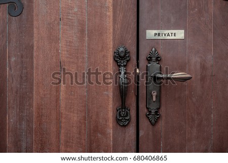 Old wooden entrance private door with antique door handle
