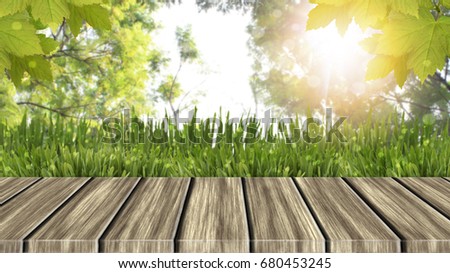 Empty of wood table top on blur of fresh green nature abstract from garden or forrest with sunlight .can be used for display or montage your products.Mock up for display of product.