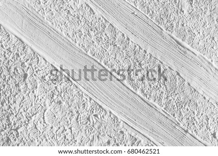 Texture of white paint with a pattern of strips. Background for greeting card.