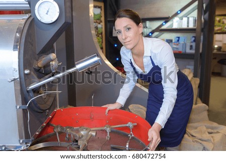woman standing in fermentation compartment on factory