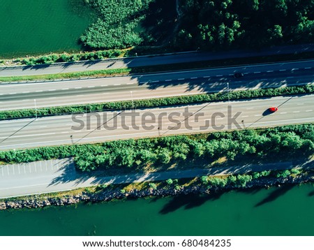 Aerial View of road above a lake