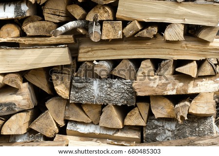 A lot of birch firewood. Pile of cut logs as a natural look background