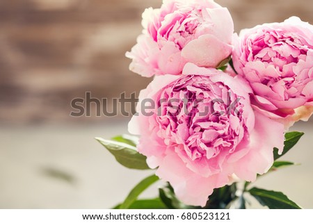 Fresh bunch of pink and white peonies, peony roses flowers. Pastel floral wallpaper with lavender background. Card, text place, copy space.