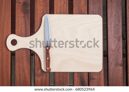 cutting board top view on wood background