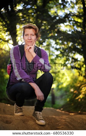 Beautiful woman relaxing in the park after the running