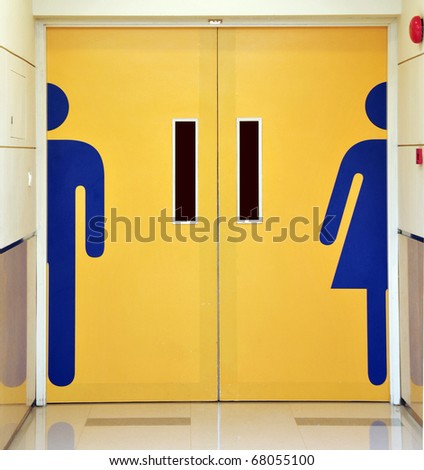 Male and female sign on a door