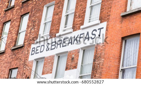 Dublin, Ireland, Bed and Breakfast panel on a brick wall