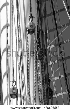 Masts of an old sailboat. Black and white photo.