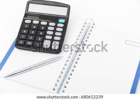 Business concept with calculator, pen and notebook