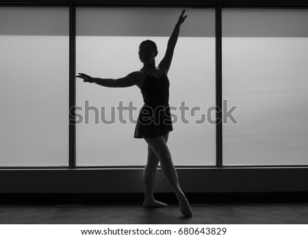 Black and White version of Ballet dancer Silhouette in a Window frame