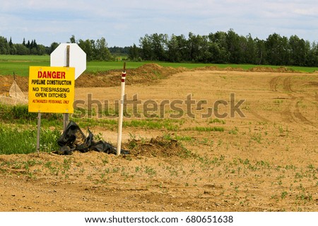 Danger Pipeline Construction sign with No Trespassing.