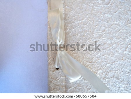 white wedding wish book decorated with bow and lace, guest book