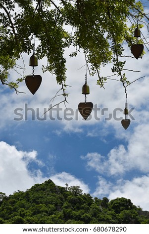 Natural background sky forest and mountain with brass bell and empty space for text. Buddhist temple.