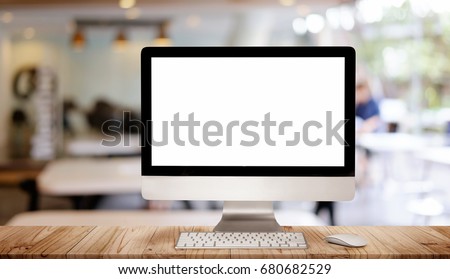 Work place concept : Mock up Blank screen computer desktop with keyboard in cafe or co-working background. Royalty-Free Stock Photo #680682529