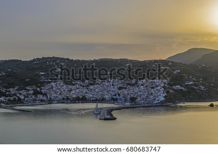 Idyllic sunset over Skopelos island, Greece. Located between Skiathos and Alonissos, Skopelos is a beautiful island that attracts mostly families and romantic couples.