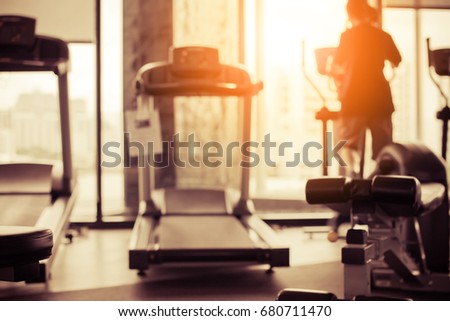 blur image of Fitness hall with the sport bikes in it health concept