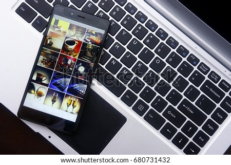 Photo of a smartphone and laptop computer