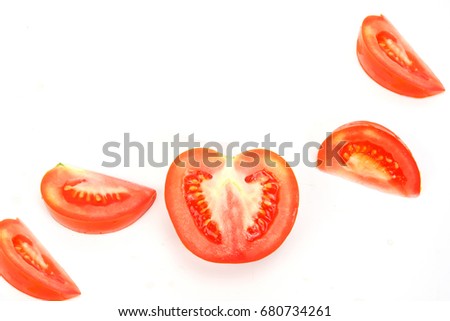 Fresh Tomatoes Sliced and a half Beneficial to the body made into a drink, cook, make a sauce. isolated on white Background. Royalty-Free Stock Photo #680734261