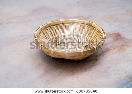 Basket basketry isolated on wooden background.