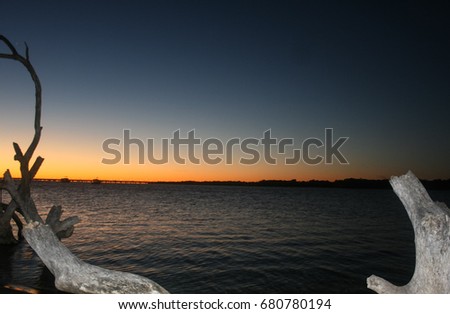 A photograph of the North Pine River as the sun is rising. This photo was taken in Brisbane, Australia. 
