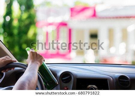 Man drinking while driving, blur image of home sweet home as background. Family always waiting for you.